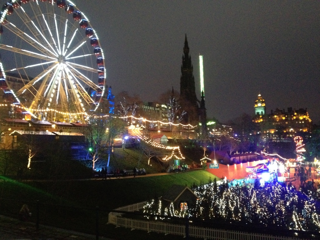 Brightly lit Big Wheel, market stalls, ice rink and Christmas Tree maze in Princes Street Gardens