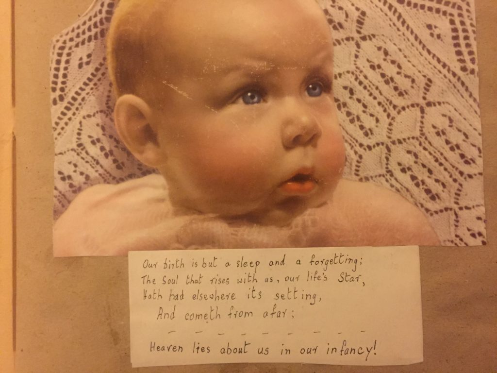 A rosy cheeked baby with lines of Wordsworth, 'Heaven lies about us in our infancy'.