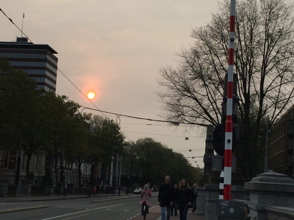 Hazy fireball of sun in Amsterdam after Ophelia 