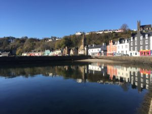On the way to Tobermory Book Festival, A flat calm surface reflects the colours of Tobermory Main Street, October 2018